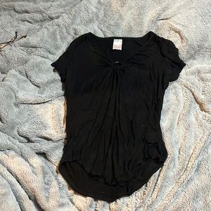 Black shirt with silver circle in front